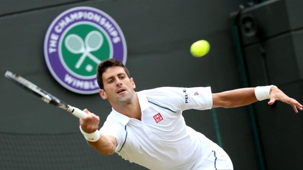 Novak Djokovic in action against Kevin Anderson during their resumed fourth round match at Wimbledon: the Serb was relieved to win. Photograph: Seán Dempsey/EPA