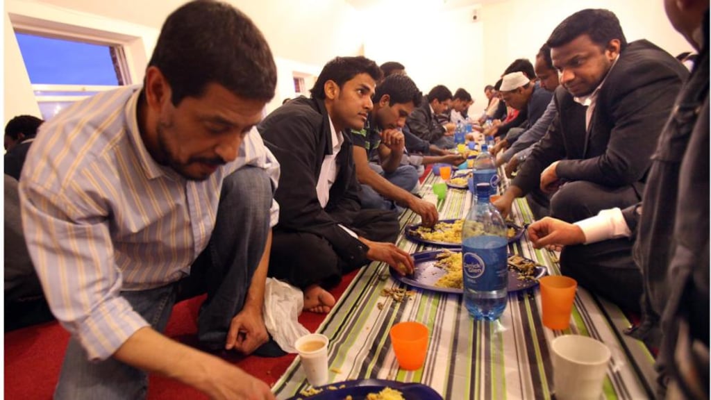 Men gather at the Anwar-i-Madina Mosque on Talbot Street, Dublin to eat after fasting and praying during Ramadan. Photograph: Brenda Fitzsimons.
