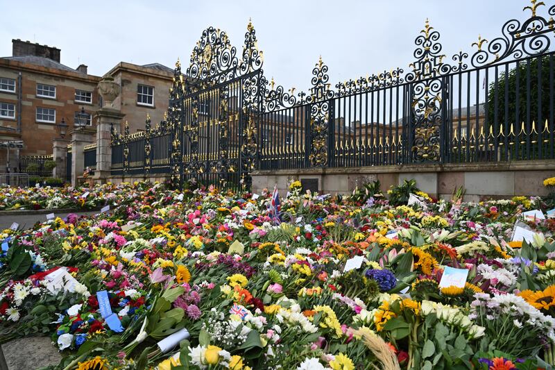 Floral tributes to Queen Elizabeth II outside Hillsborough Castle, Co Down, on Tuesday. Photograph: Michael Cooper/PA