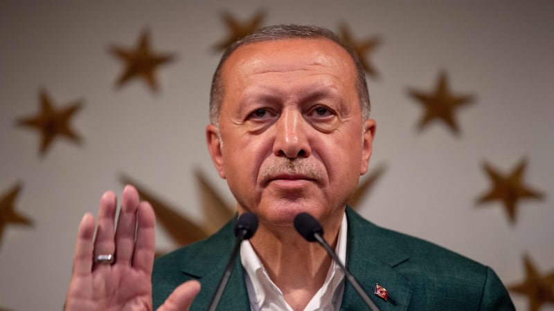 Turkish president Recep Tayyip Erdogan prepares to deliver a speech on the stage of the conference room at Huber Mansion in Istanbul on Monday, following local elections. Photograph: Bulent Kilic/AFP/Getty Images