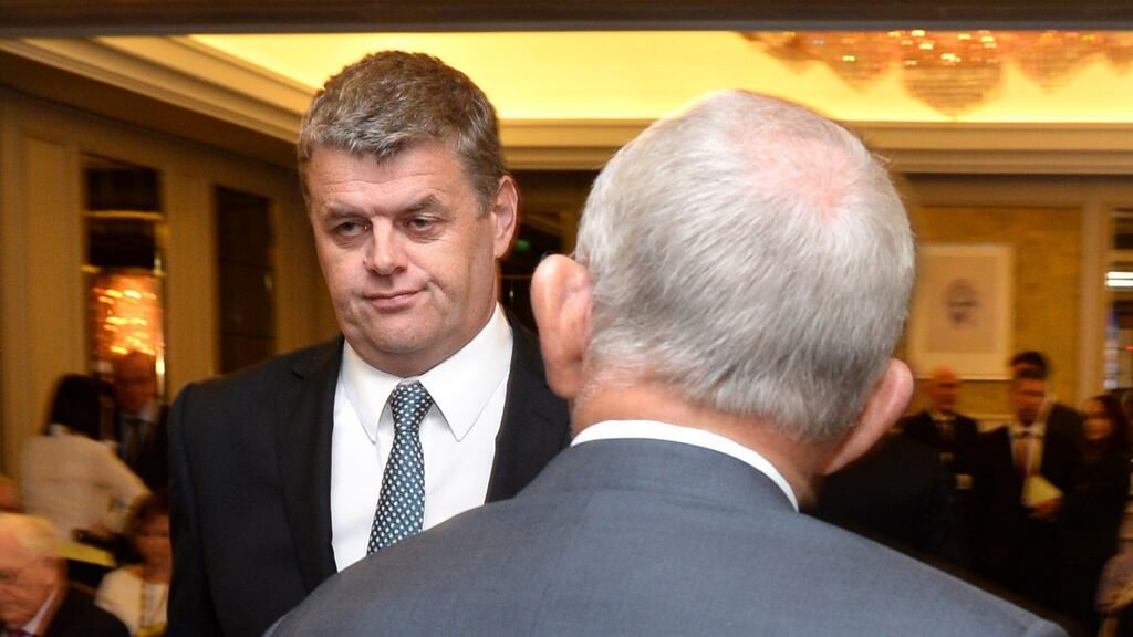 Former INM chief executive Robert Pitt (left) walks past company chairman Leslie Buckley at the media group’s AGM in August. Photograph: Dara Mac Dónaill