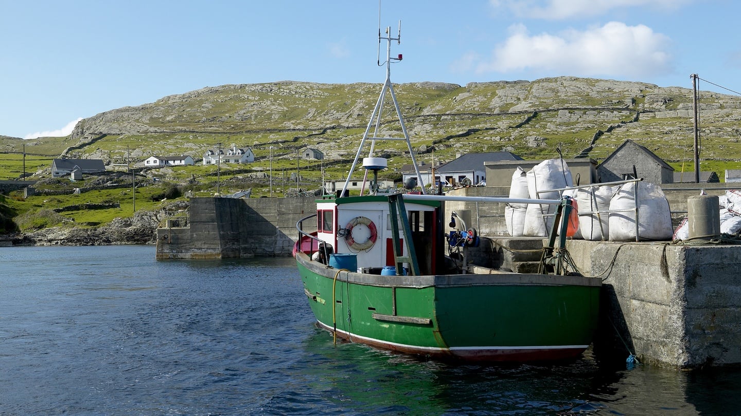 Last stop: a fishing trawler moored in a harbour on Inishturk. Photograph: Pete Ryan/National Geographic/Getty