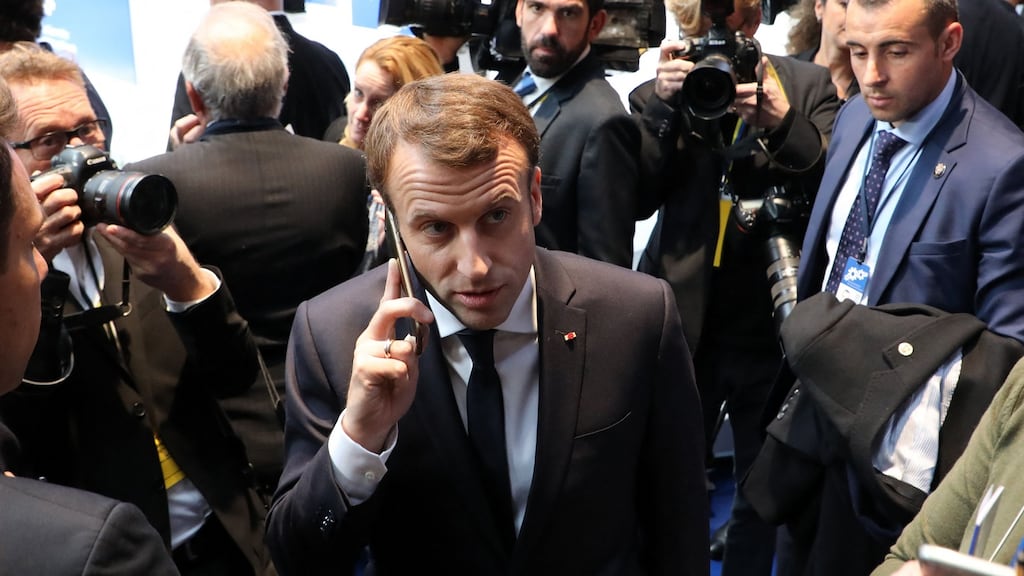 French president Emmanuel Macron (centre) speaks on his mobile phone during the European Social Summit in Gothenburg, Sweden in 2017. Photograph: Ludovic Marin/AFP via Getty
