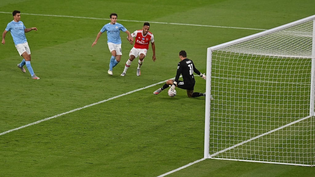 Pierre-Emerick Aubameyang scores his second goal against Manchester City at Wembley Stadium. Photograph: Getty Images