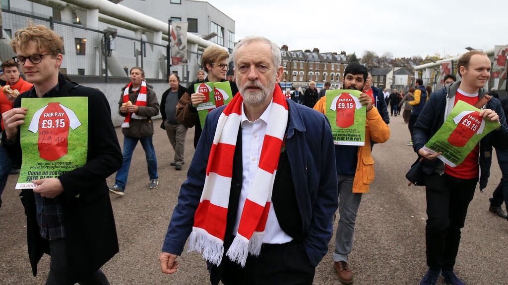 British Labour leader Jeremy Corbyn with football fans protesting against football ticket prices before Arsenal’s match against Spurs in London on Sunday. Photograph: Nigel French/PA Wire.