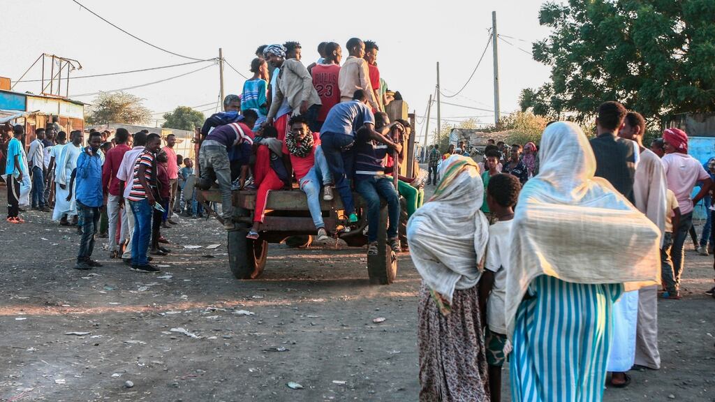 Ethiopians fleeing intense fighting in their homeland of Tigray, gather in a bordering Sudanese village, east of the town of Gadaref, on Friday. Photograph: Ebrahim Hamid/AFP via Getty Images