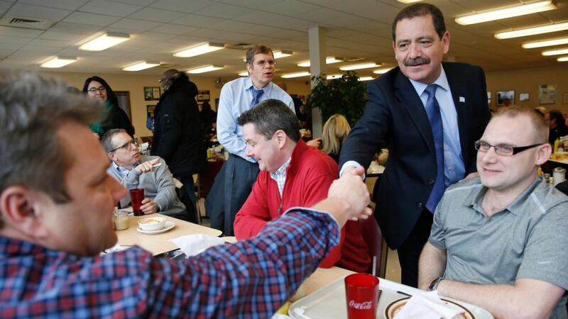 Chicago Mayoral candidate Jesus “Chuy” Garcia (second right) greets restaurant patrons, during a campaign stop on election day in Chicago, February 24th. Garcia, a Latino former alderman and state legislator with strong links to organised labour, and who had run specifically at the request of the teacher unions, is on a roll.’ Photograph: REUTERS/Jim Young