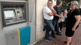 Greeks wake up to shuttered banks and a climate of rumours