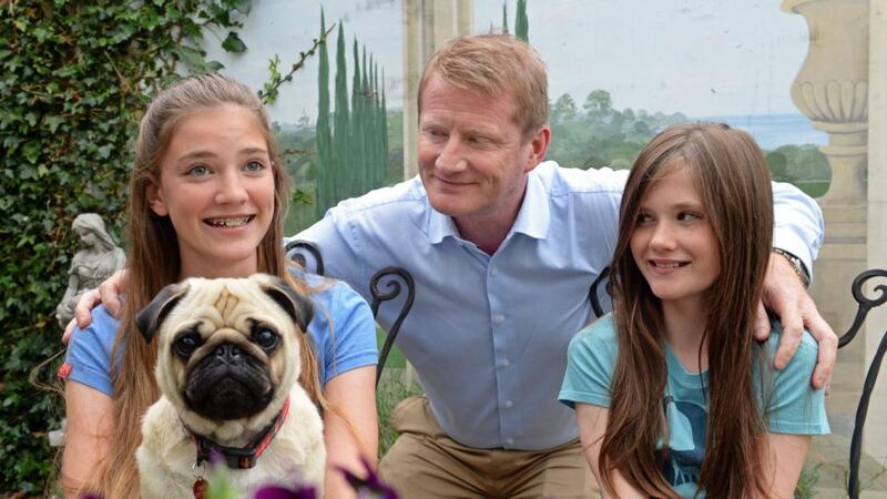 Family: John Gibbons with his daughters, Sophie and Simone. Photograph: Eric Luke