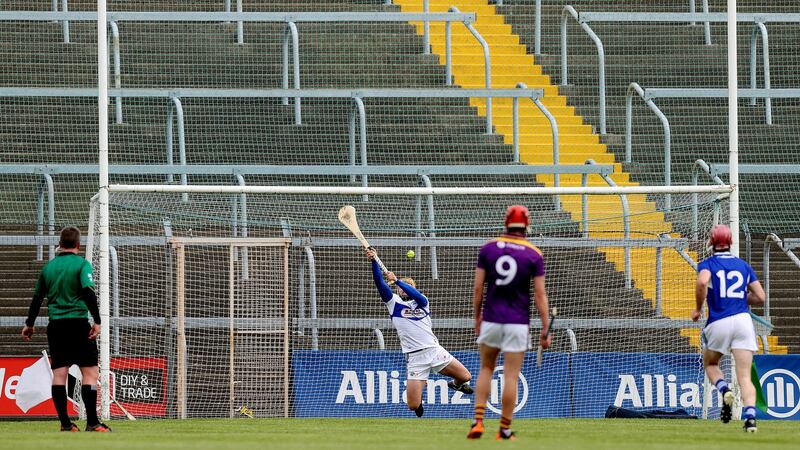 Laois goalkeeper Enda Rowland saves a penalty against Wexford. Photograph: Bryan Keane/Inpho