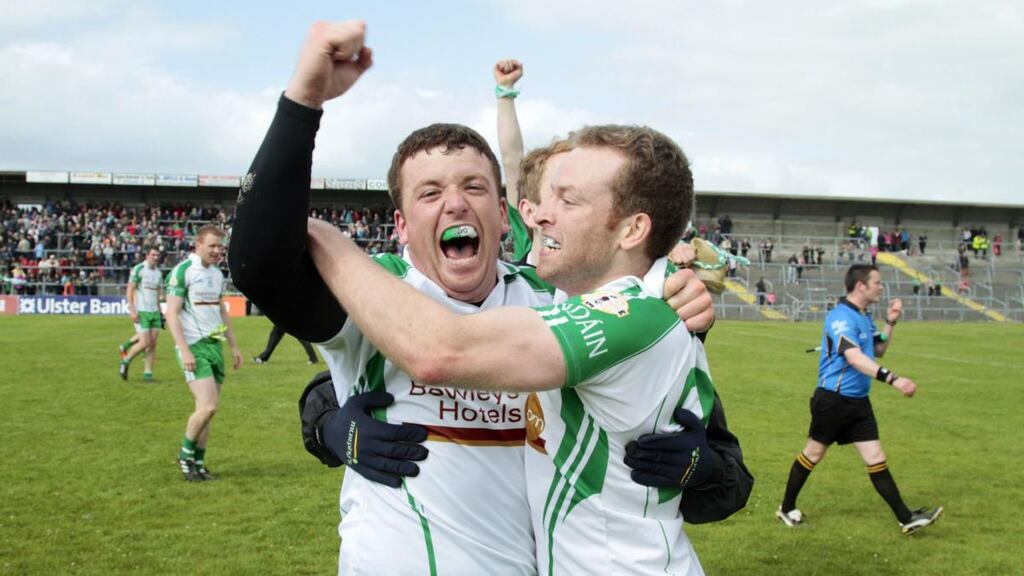 London’s Seán Kelly and Brian Collins celebrate at the final whistle after the victory over Leitrim in the 2013 Connacht SFC semi-final replay at Dr Hyde Park in Roscommon. Photograph: Mike Shaughnessy/Inpho