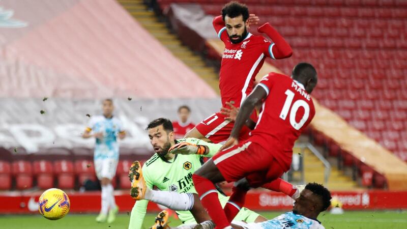 Nelson Semedo of Wolves scores an own goal, the fourth his side conceded in the Premier League game against Liverpool at Anfield. Photograph: Clive Brunskill/Getty Images