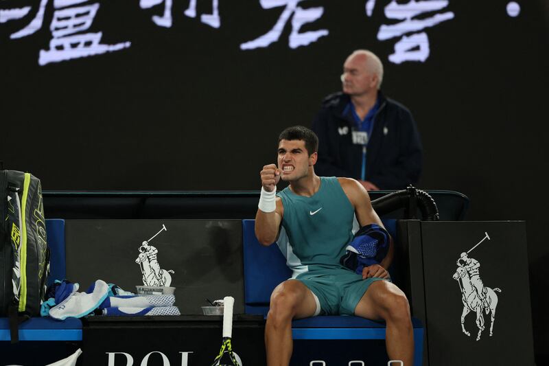 Spain's Carlos Alcaraz reacts after a point in a long rally against Serbia's Novak Djokovic during their men's singles quarter-final. Photograph: Aadrian Dennis/AFP via Getty Images