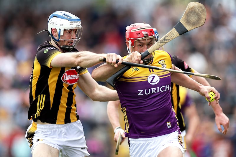 Wexford's Lee Chin and Huw Lawlor of Kilkenny in a tackle during the game. Photograph: Laszlo Geczo/Inpho