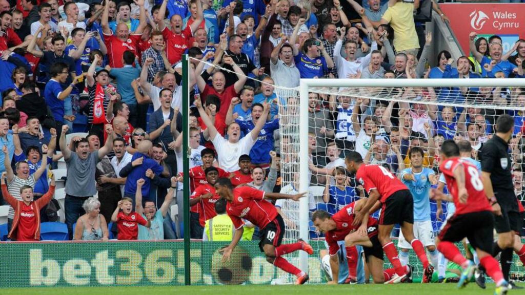 Cardiff City’s Fraizer Campbell (L) celebrates after scoring against Manchester City at Cardiff City Stadium Photograph: Rebecca Naden/Reuters