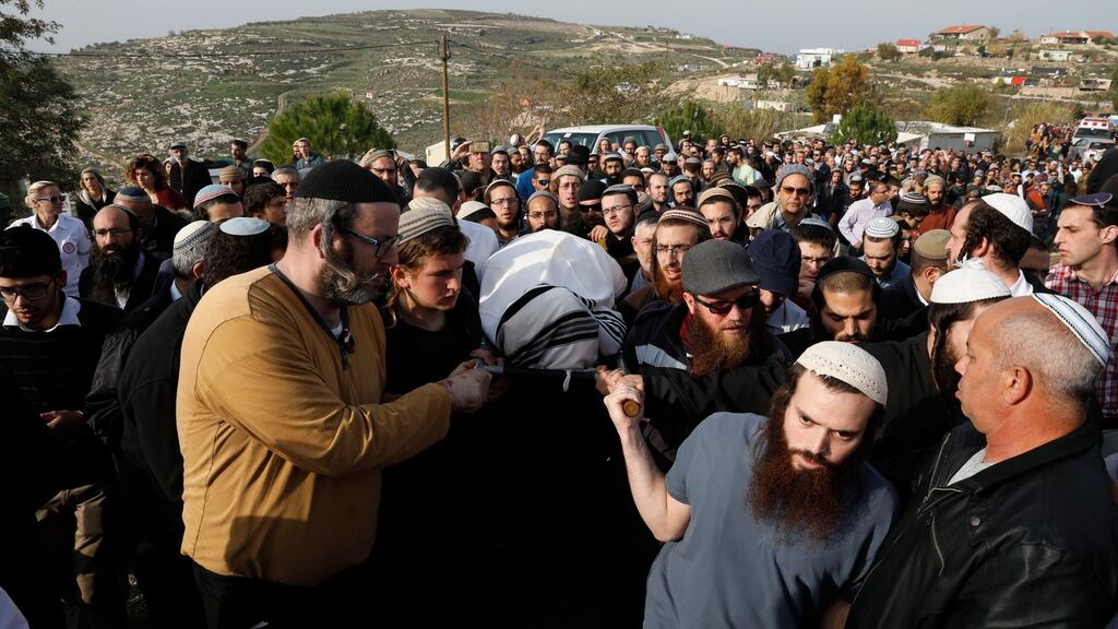 Family and relatives carry the body of Israeli settler Rabbi Raziel Shevah during his funeral in Havat Gilad settlement in the West Bank on Wednesday. Rabbi Raziel Shevah was killed  in a drive-by shooting on Tuesday. Photograph: Abir Sultan/EPA