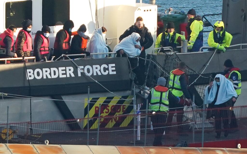 People thought to be migrants are brought in to Dover on a Border Force vessel: Last year, more than 45,700 asylum seekers made the perilous 50km crossing from the northern French coast on inflatables and dinghies. Photograph: Gareth Fuller