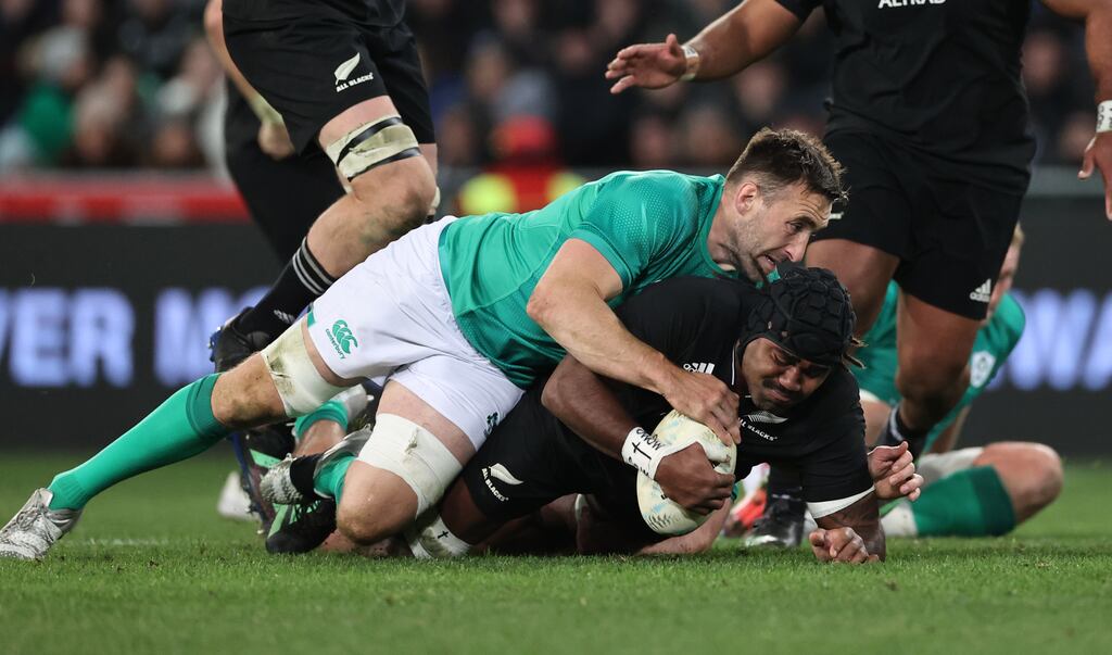 Jack Conan tackles Pita Gus Sowakula of the All Blacks during their second test as part of Ireland's rugby tour to New Zealand, in Forsyth Barr Stadium, Dunedin. Photograph: ©INPHO/Billy Stickland