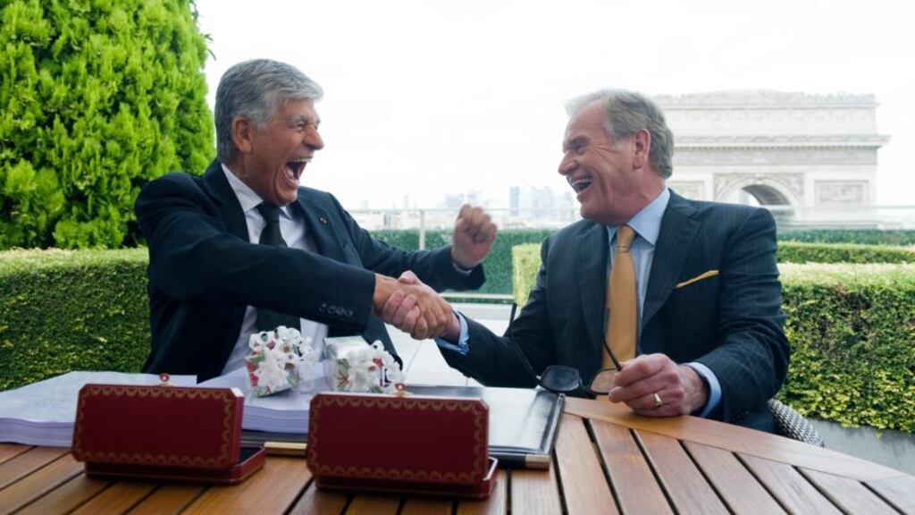 Publicis chief executive Maurice Lévy (left) and Omnicom chief executive John Wren shake hands on the merger during a news conference held on the rooftop of the Publicis headquarters in Paris last month. Photograph: Balint Porneczi/Bloomberg