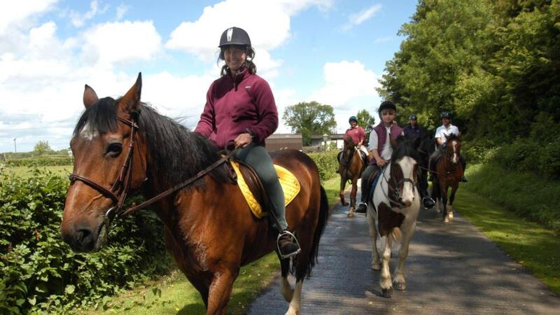 Eileen Battersby and her daughter, Nadia, on horseback in 2004. Photograph: Joe St Leger