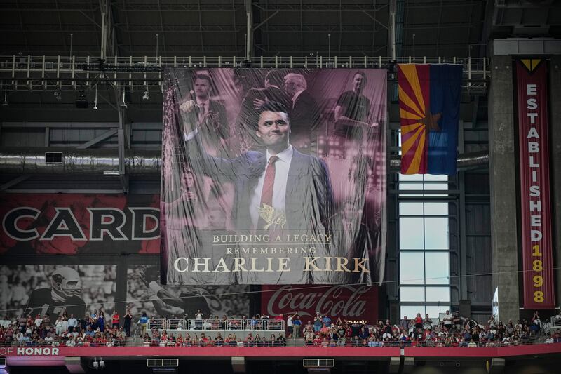 A banner for conservative activist Charlie Kirk during the memorial service. Photograph: AP