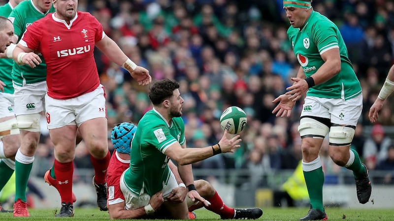 Robbie Henshaw offloads to CJ Stander during Ireland’s win over Wales. Photograph: Bryan Keane/Inpho
