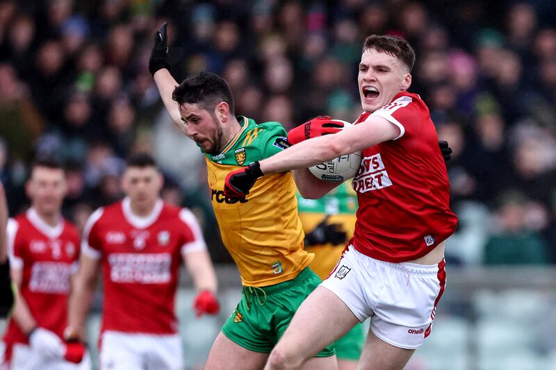 Cork's David Buckley is tackled by Ryan McHugh of Donegal. Photograph: Ben Brady/Inpho