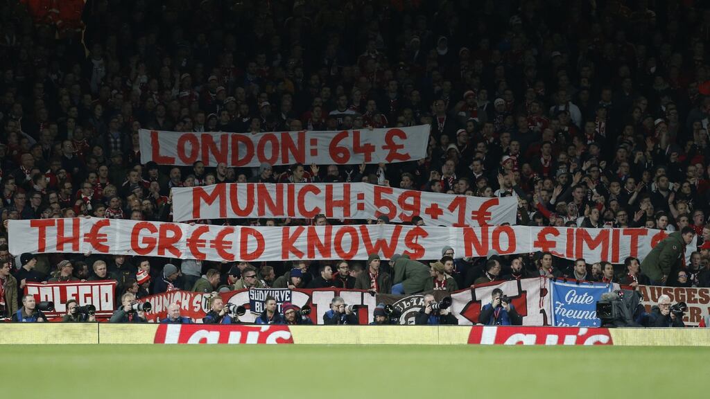 Bayern Munich fans raise a banner to complain about the cost of tickets during the Champions League last 16 second-leg match against Arsenal at the Emirates Stadium in London in March 2017. Photograph: Ian Kington/AFP/Getty Images