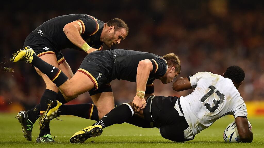 Fiji’s centre Vereniki Goneva is tackled by Dan Biggar and Jamie Roberts of Wales during the Rugby World Cup Pool A match at the Millennium stadium in Cardiff. Photograph: Gabriel Bouys/AFP/Getty Images