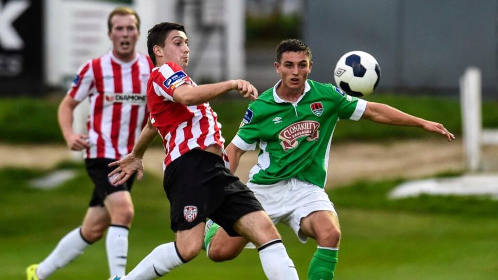 Derry’s Shaun Kelly and Cork’s Josh O’Shea in action at the Brandywell last night. Photo: Russell Pritchard/Iinpho