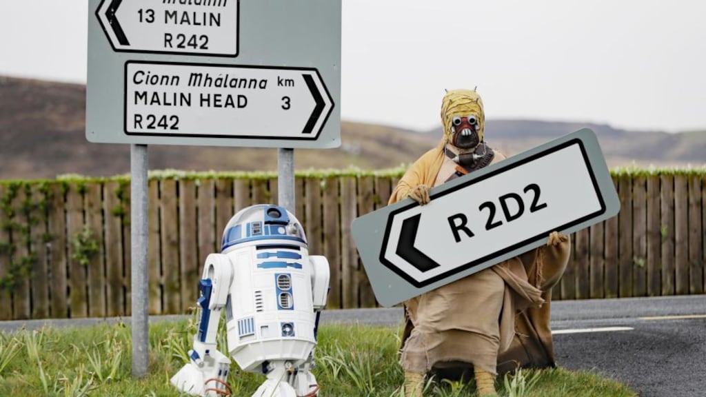 A Tusken Raider character poses with an R2D2 droid replica at the opening of the R2D2 road in Malin Head, Co Donegal on Monday. Photograph: Niall Carson/PA Wire