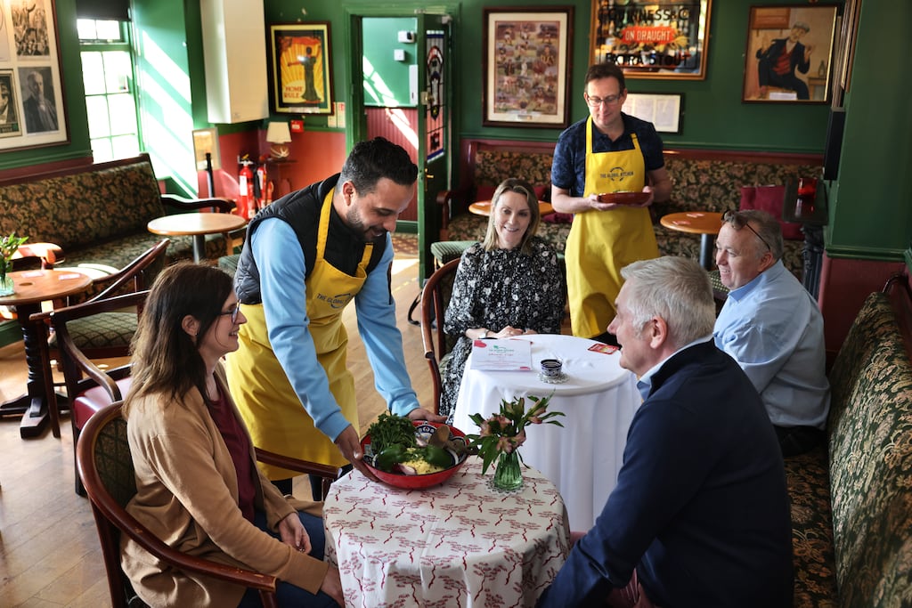 Amanda deBurca and Martin Rafter with Sharon O’Gorman and Karl Osborne, being served by Youcef Hassan Chergui and Fergus Horgan, in the Global Kitchen. Photograph: Dara Mac Dónaill