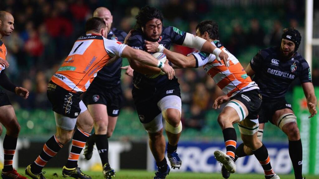 Treviso’s Michele Rizzo and Alessandro Zanni try to tackle Logovi’i Mulipola of the Leicester Tigers during the Heineken Cup match at Welford Road. Photograph: Michael Regan/Getty Images