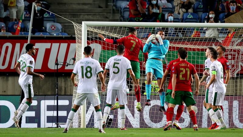 Gavin Bazunu claims the ball ahead of Cristiano Ronaldo. Photograph: Ryan Byrne/Inpho