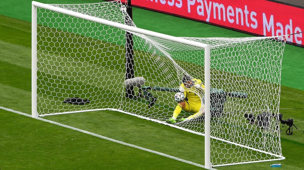 Scotland goalkeeper David Marshall gets tangles up in the net after being beaten from long range by a shot from Czech Republic’s Patrik Schick during the Euro 2020 game at Hampden Park. Photograph: Andy Buchanan/Getty Images