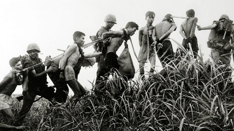 Captured Viet Cong prisoners being moved by US marines in March 1965. Photograph: Rolls Press/Popperfoto/Getty Images