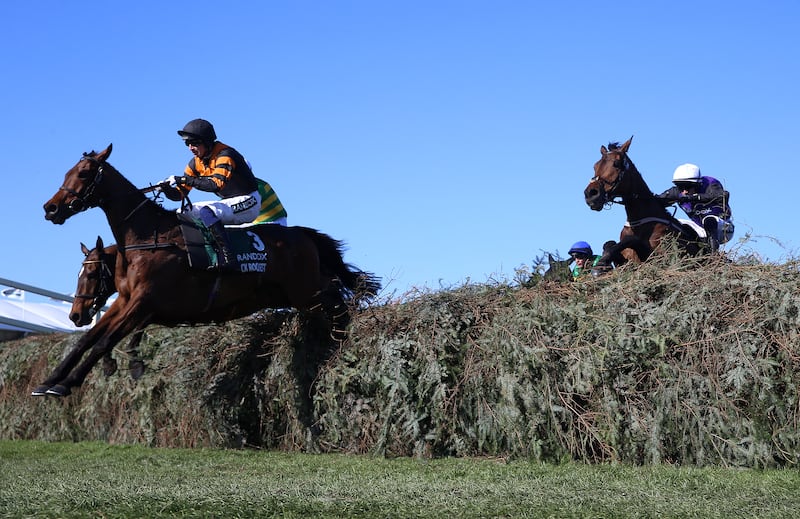 Nick Rockett and jockey Patrick Mullins on their way to winning the Randox Grand National. Photograph: Nigel French for The Jockey Club/PA Wire