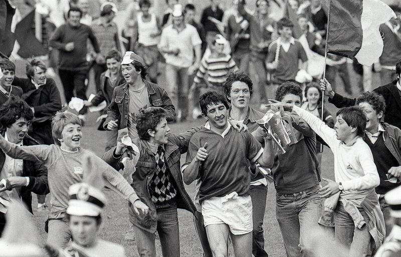 John Fenton and supporters with the trophy after Cork's dramatic victory over Tipperary in the 1984 Munster senior hurling final. Photograph: Billy Stickland/Inpho