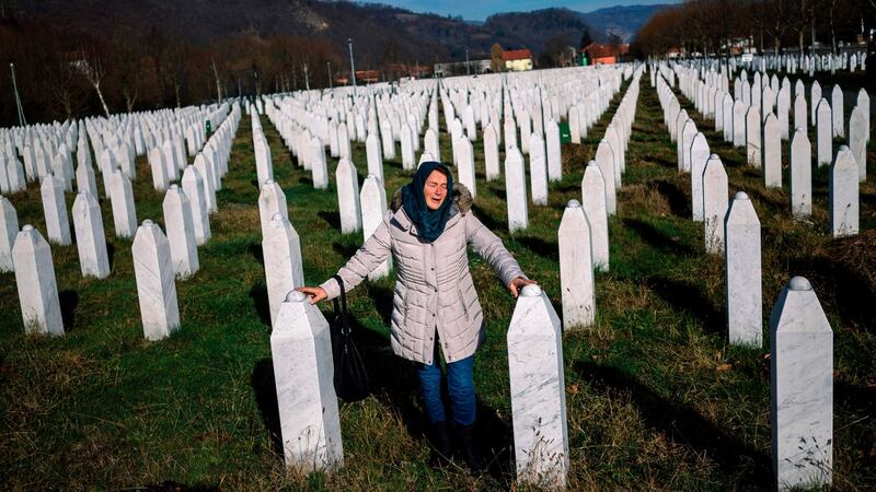 A woman mourns over a relative’s grave at a memorial centre near Srebrenica, Bosnia and Herzegovina,  on Wednesday. Photograph: Dimitar Dilkoff/AFP/Getty