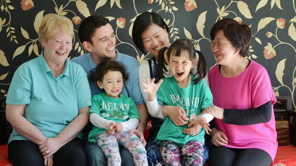 Anthony Kelly and Li Qiong Zhao with their children, Annabelle and Maybelle, and grandmothers Kathleen Kelly and Guo Ying Zhang. Photograph: Alan Betson
