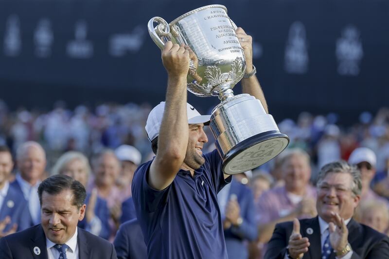 Scottie Scheffler of the US holds up the Wanamaker Trophy. Photograph: Erik S Lesser/EPA