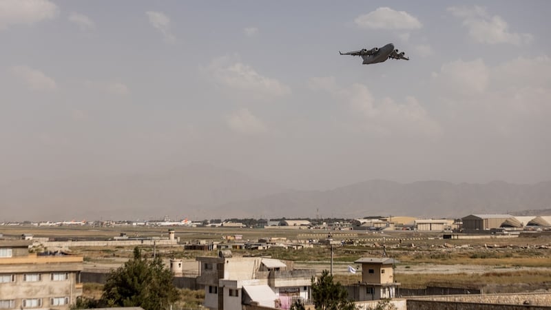 A military cargo plane takes off from the airport in Kabul. Photograph: Jim Huylebroek/The New York Times