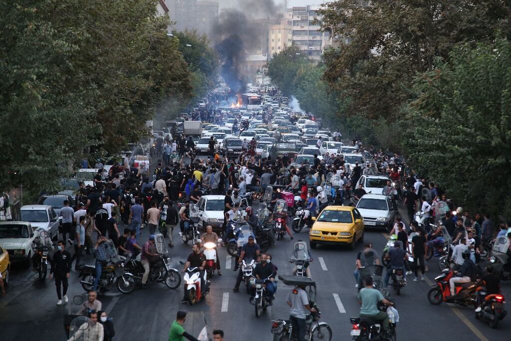 Protesters clash with police following the death of Mahsa Amini in Tehran, Iran, on September 21st. Photograph: EPA