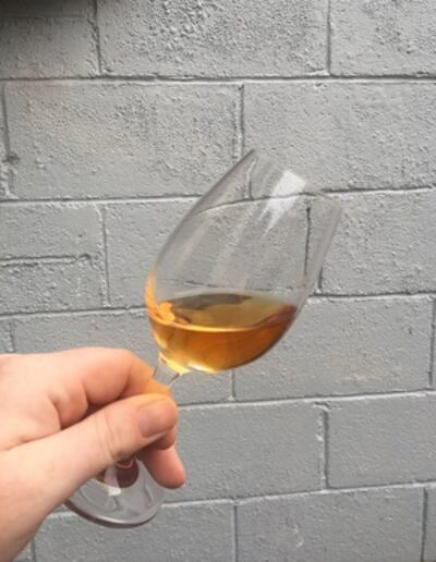 A glass of Proper No Twelve whiskey