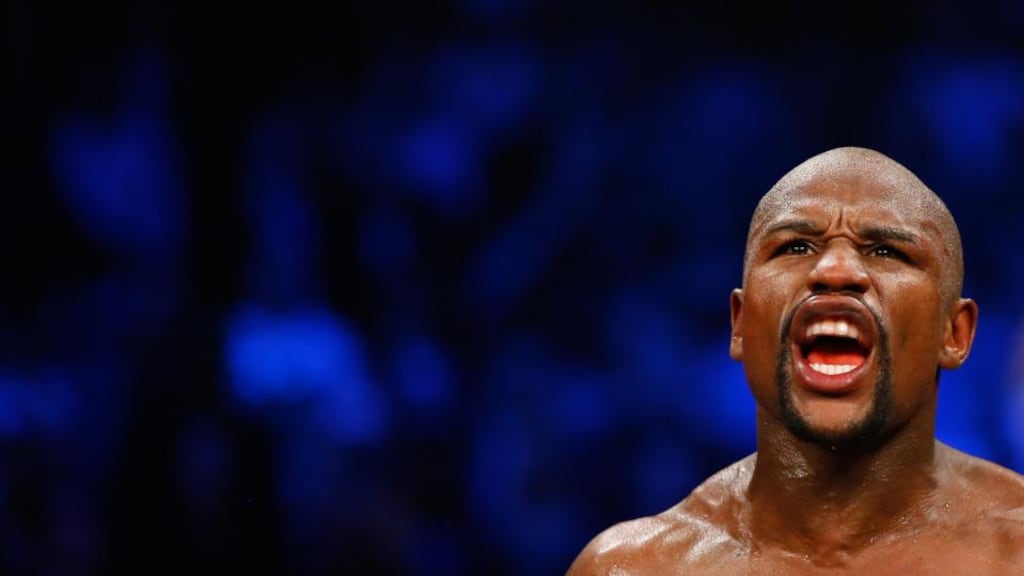 Floyd Mayweather Jr. reacts after the 12th round against Manny Pacquiao in their welterweight unification championship bout. Photo: Al Bello/Getty Images