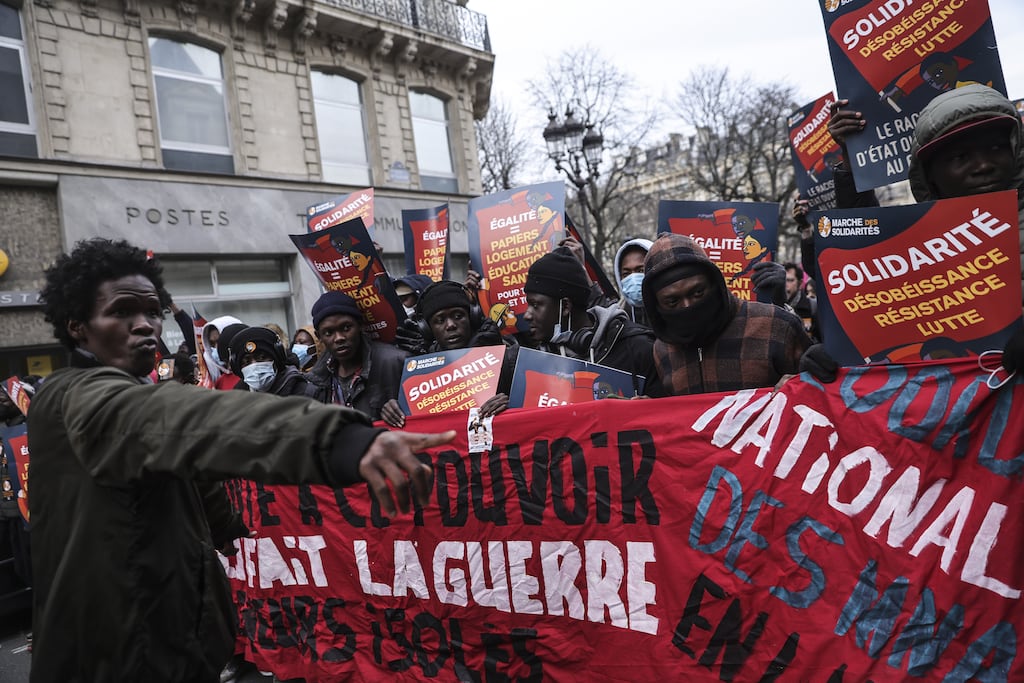 People take part in a demonstration to demand shelter for more than 300 young people who have been occupying the Gaite Lyrique. Photograph: Teresa Suarez/EPA
