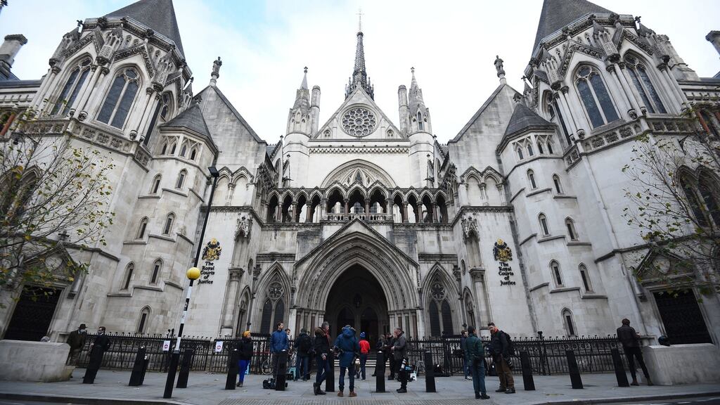Members of the press wait outside the Royal Courts of Justice in central London, ahead of the first hearing in Rebekah Vardy’s High Court libel claim against Coleen Rooney. Photograph: PA