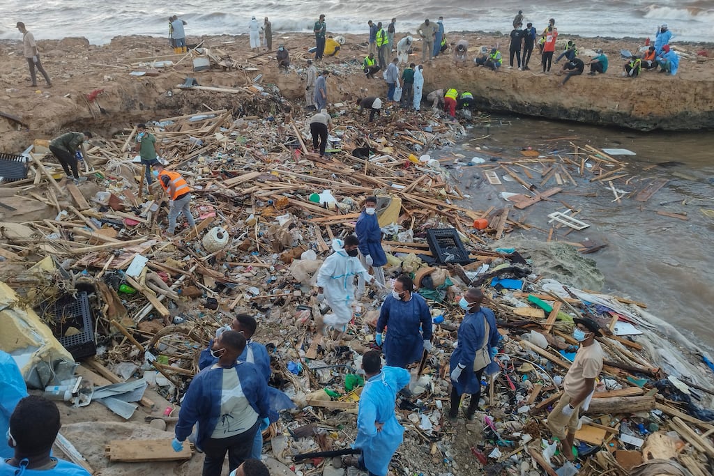Rescuers and relatives search for bodies of the flood victims in the city of Derna, Libya. Photograph: Abdulaziz Almnsori/AP