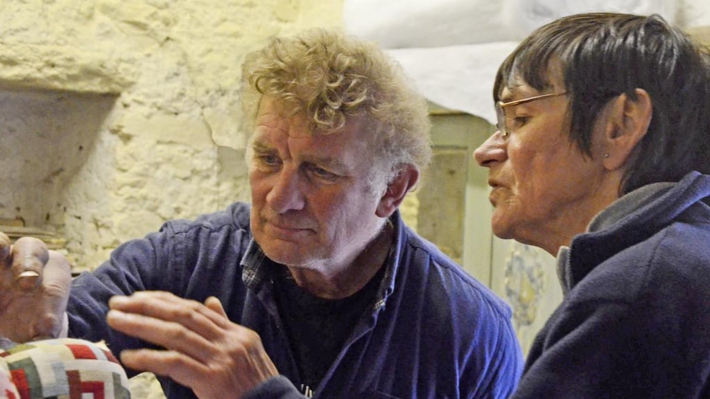 Nigel Barnes and Pepie O'Sullivan busy upholstering a chair in Co Clare