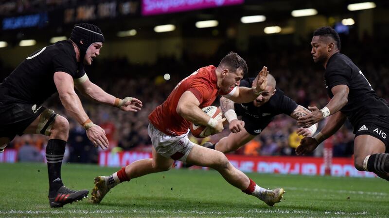 Gareth Davies breaks through the New Zealand defence to score his try. Photograph: EPA